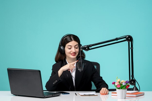 Blogger journalist lovely young girl in black blazer recording speech on camera