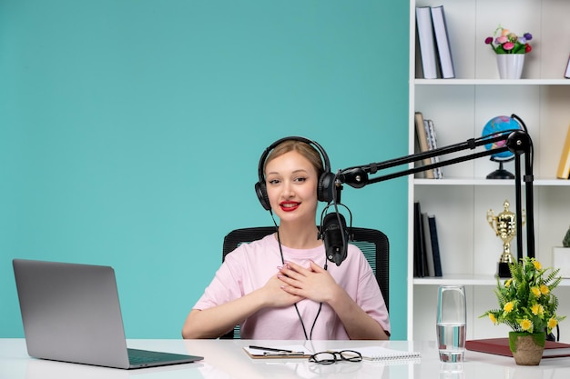 Free photo blogger journalist in office young cute blonde girl recording video on computer proud