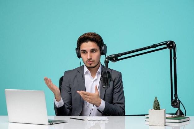 Blogger journalist recording speech cute handsome guy in office explaining