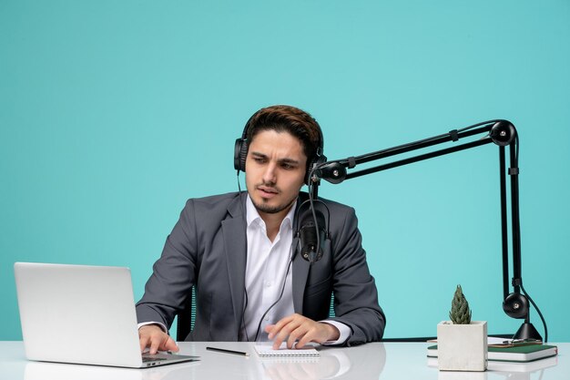 Blogger journalist recording video cute handsome guy in office focused