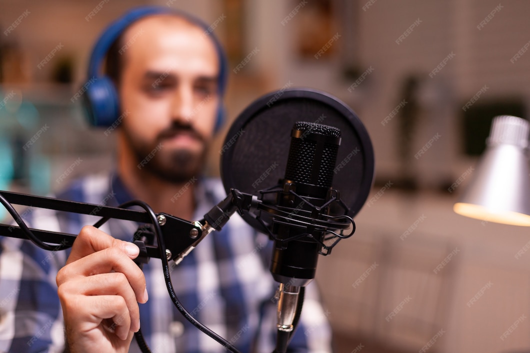 Podcaster sitting at a studio desk