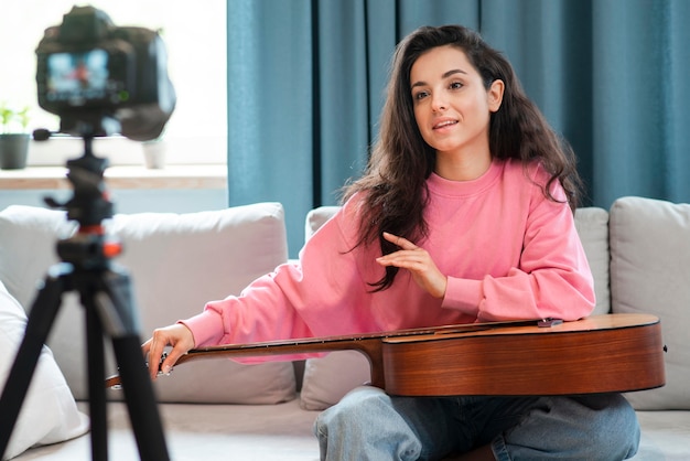 Blogger with guitar on her lap