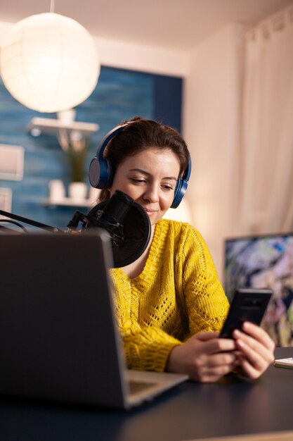 Blogger woman recording video for her blog in home studio