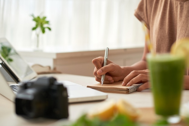 blogger writing down ideas