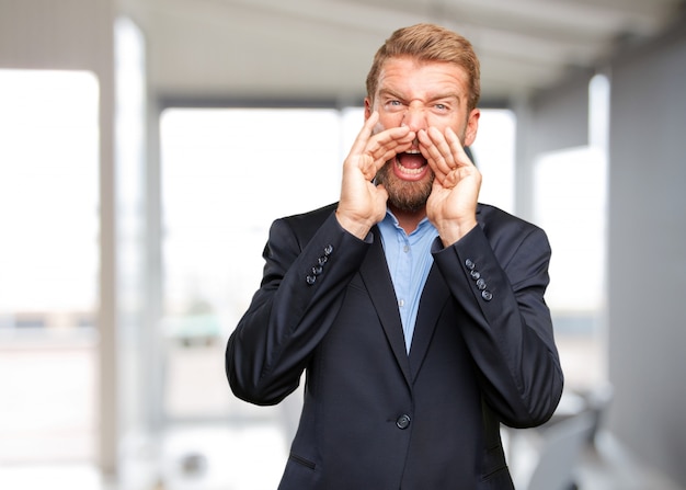 Free photo blond businessman angry expression