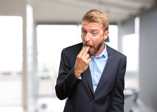 blond businessman angry expression