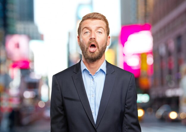 blond businessman surprised expression