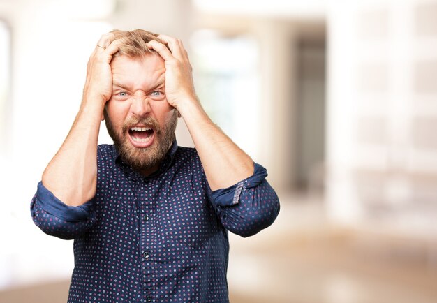 blond man angry expression