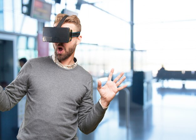 blond man with virtual glasses. surprised expression