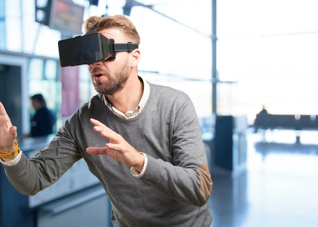 blond man with virtual glasses. surprised expression