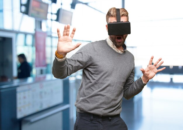 blond man with virtual glasses. surprised expression