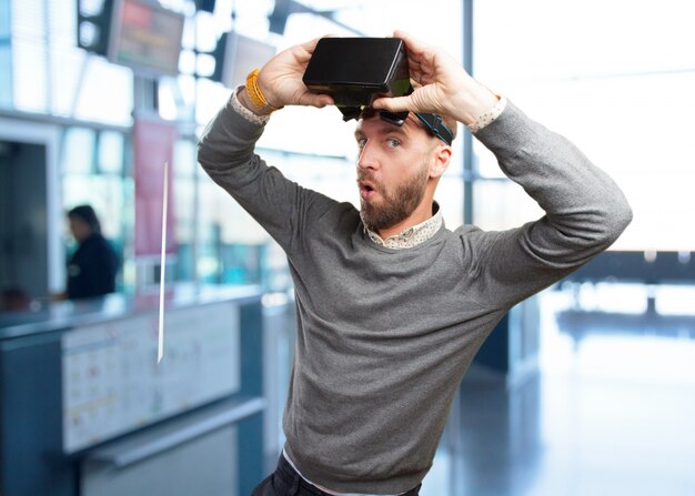 blond man with virtual glasses. surprised expression