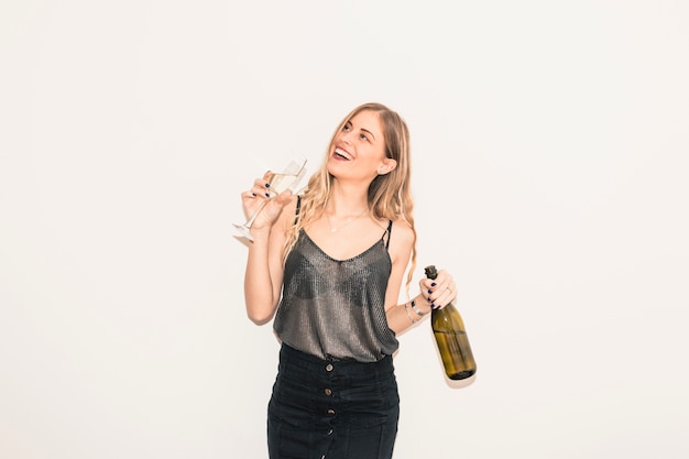 Blond woman drinking champagne from glass