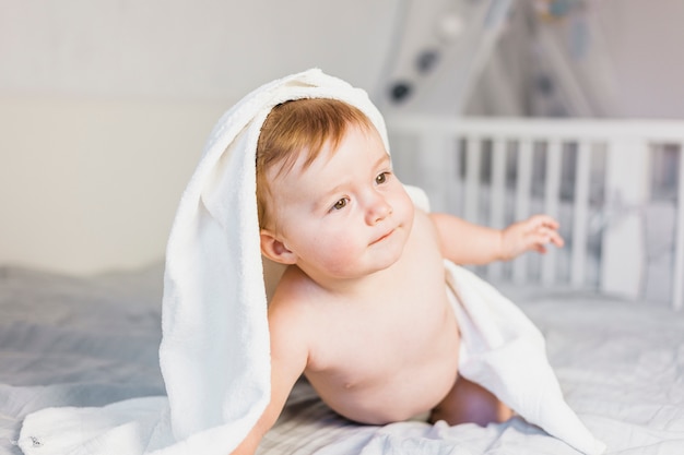 Free photo blonde baby with towel