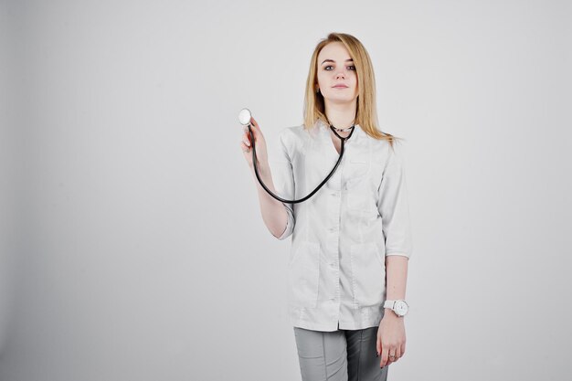 Blonde doctor nurse with stethoscope isolated on white background