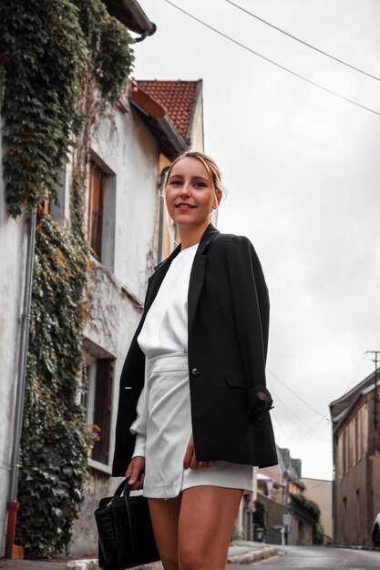 Blonde fashionable woman on street