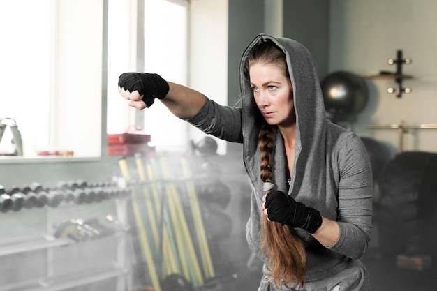 Blonde female boxer training for a new competition