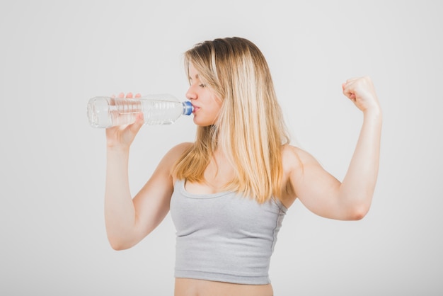 Blonde girl drinking water