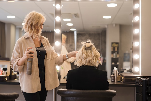 Blonde girl getting her hair done