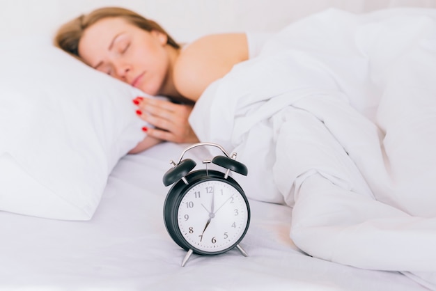 Blonde girl sleeping on the bed