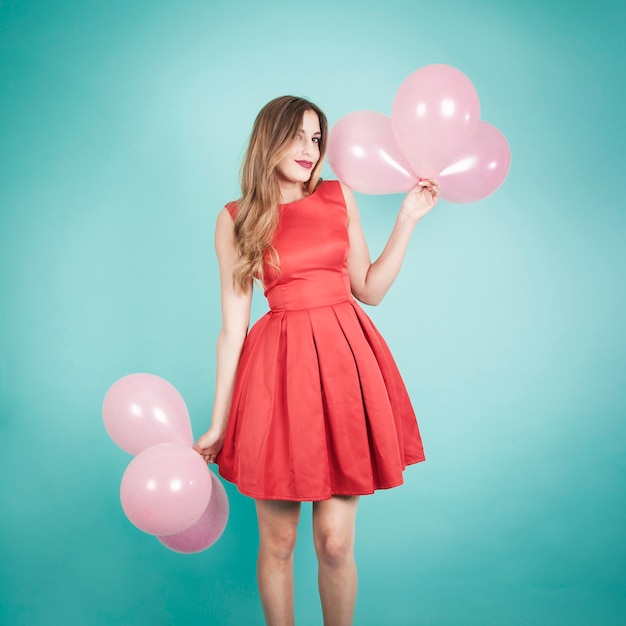 Free photo blonde girl with balloons