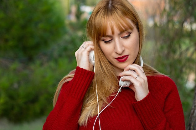 Blonde girl with headphones listening to techno - wide 7