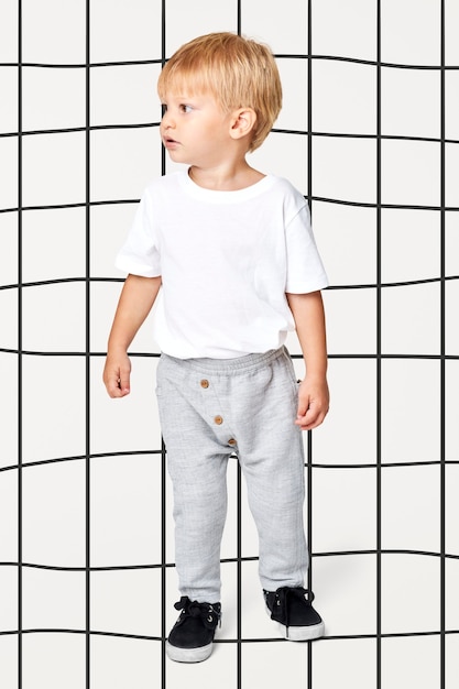 Free photo blonde kid with white tee and sweat pants