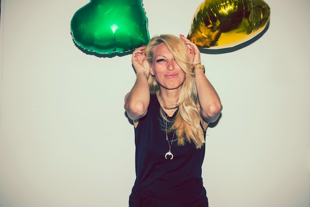 Blonde kidding with balloons