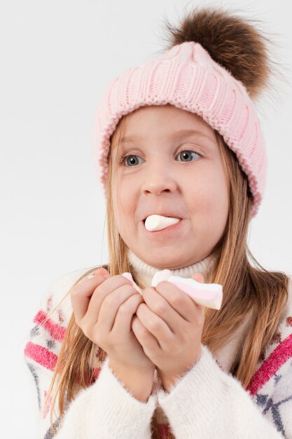 Blonde little girl chewing gum