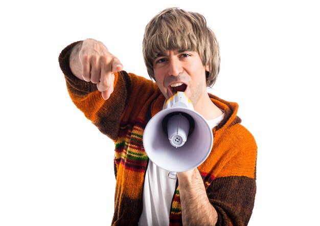 Blonde man shouting by megaphone