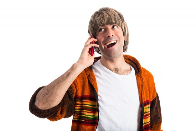 Free photo blonde man talking to mobile