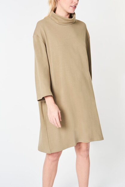 Blonde woman in a beige polo neck dress