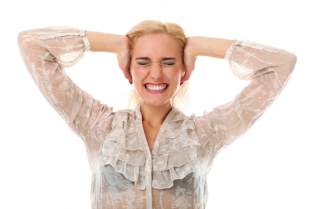 Blonde woman covering her ears