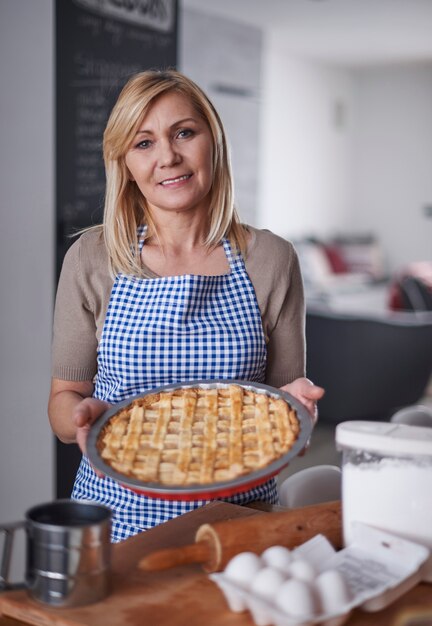 Blonde woman holding cake