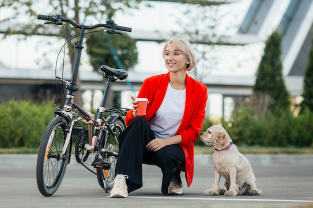 Blonde woman playing with her dog