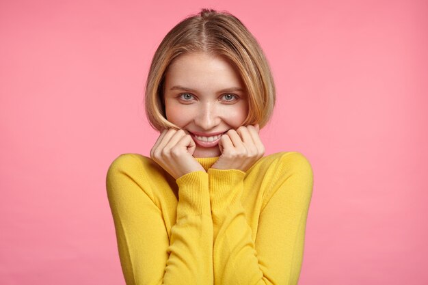 Blonde woman in turtleneck sweater