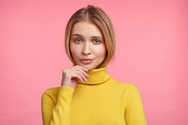 Blonde woman in turtleneck sweater