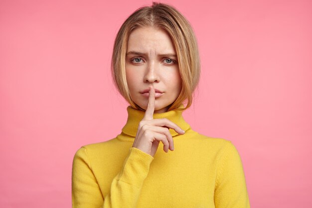 Blonde woman in turtleneck sweater