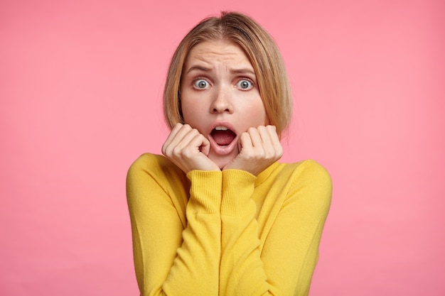 Blonde woman in turtleneck sweater