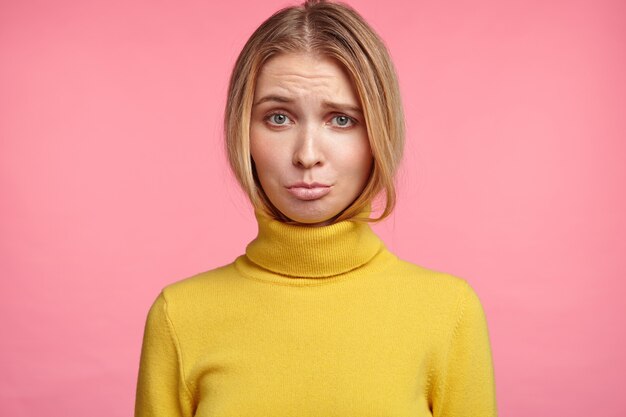 Blonde woman in turtleneck sweater