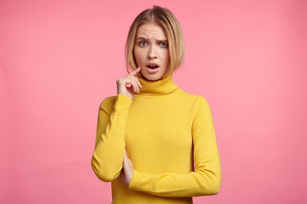 Blonde woman in turtleneck sweater