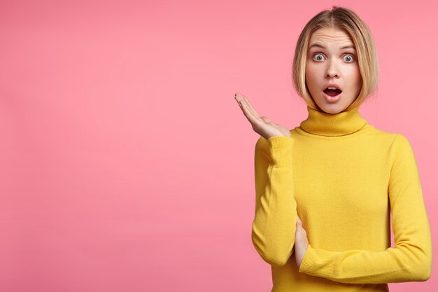 Blonde woman in turtleneck sweater