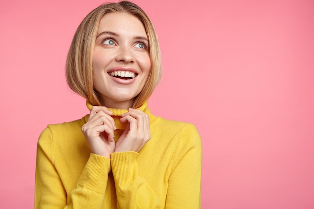 Blonde woman in turtleneck sweater