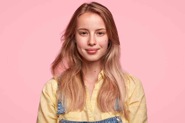 Blonde woman wearing denim overalls