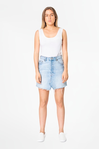 Blonde woman in white tank top and denim mini skirt casual wear fashion full body