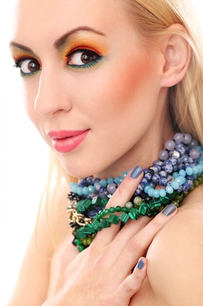 Blonde woman with necklace showing her cute colored look