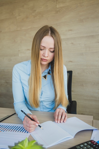 Blonde worker at desk