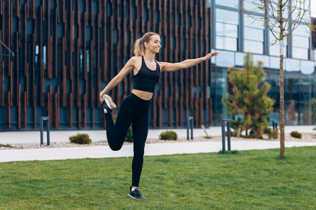 Blonde young female working out in park