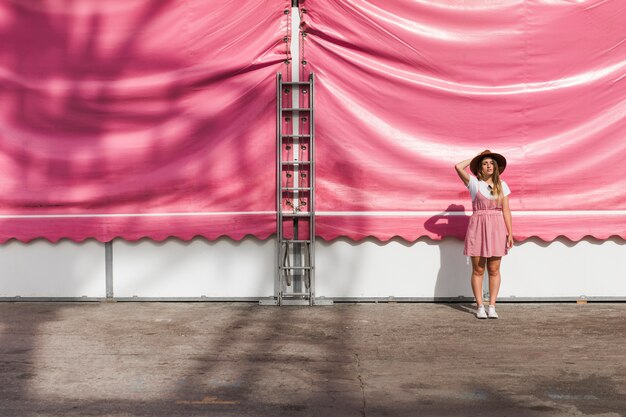 Blonde young girl in the amusement park