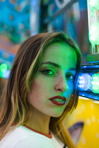 Blonde young girl in the amusement park